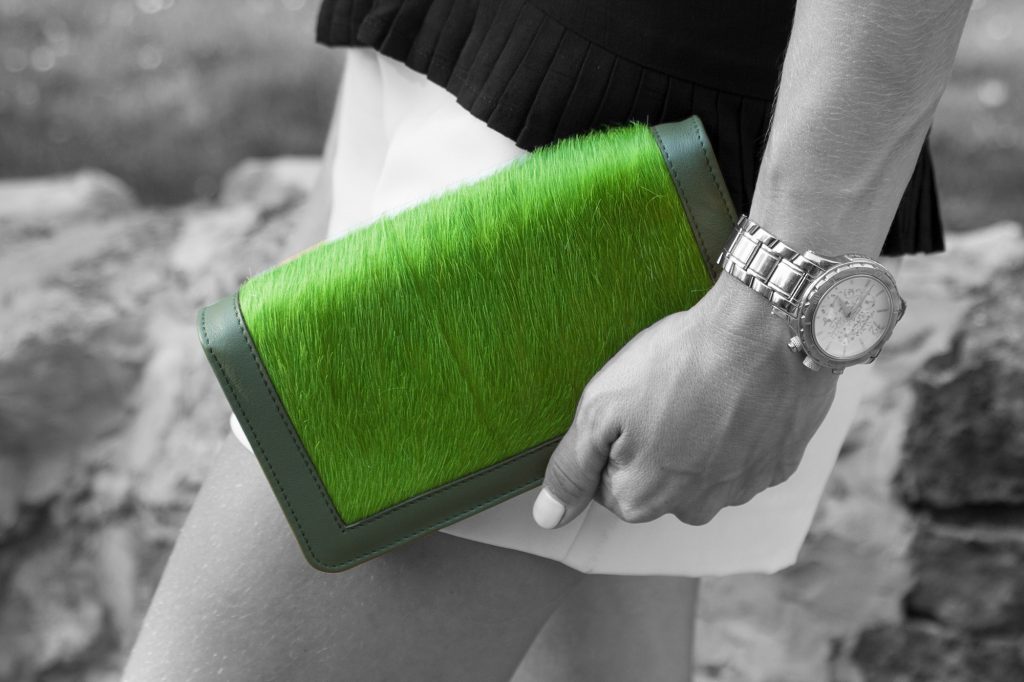 Olive Green Calf Hair Leather Clutch Bag Woman hands Black and white.jpeg