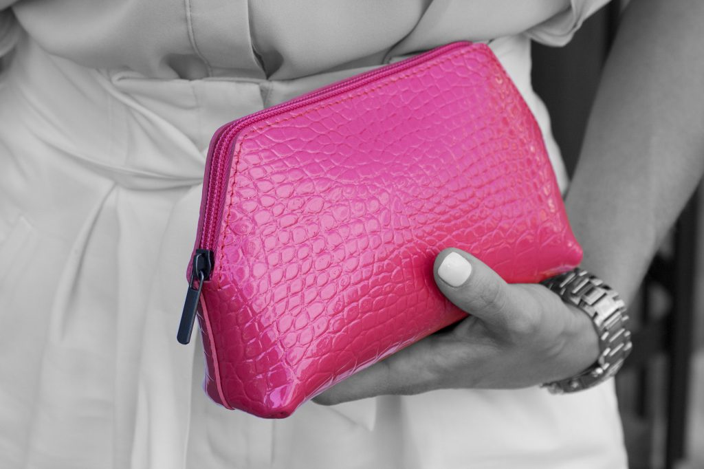 Small Cosmetic Bag in Pink Croc Leather in woman hands Black and white.jpeg